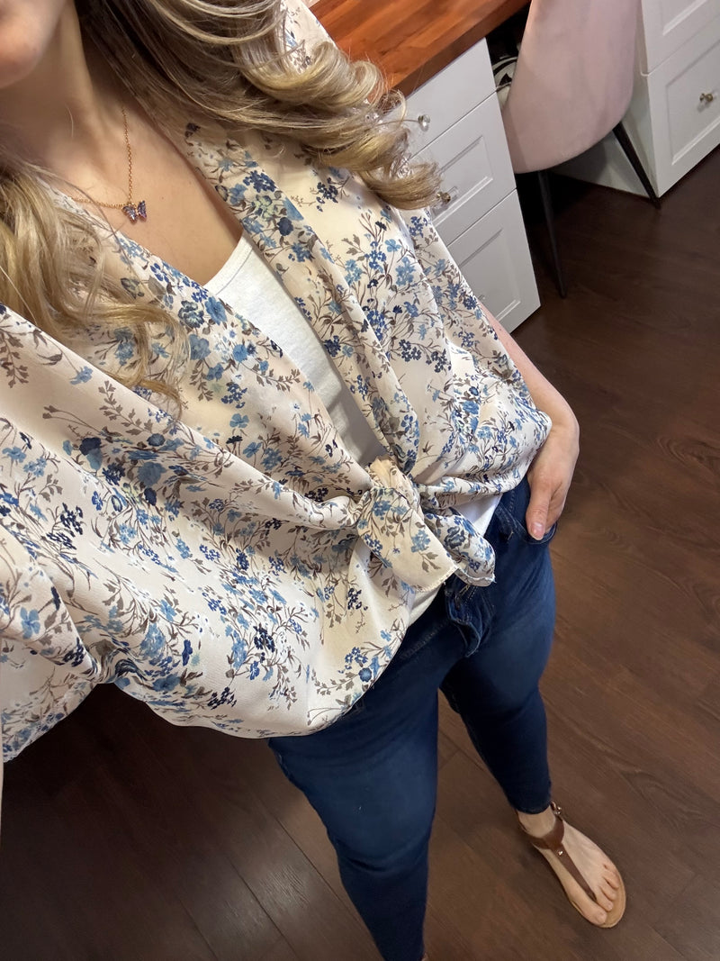  A flowy, lightweight classic kimono draped over a model, showcasing its effortless elegance. The kimono features a loose, airy fit, perfect for layering over casual outfits, dresses, or swimwear. Handmade in London, Ontario, this one-size piece fits sizes 2 to 18 and has a beautiful drape. 