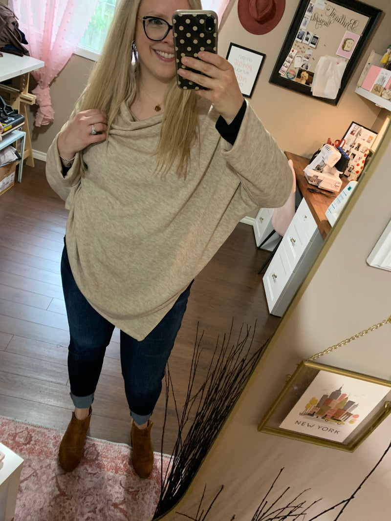 Oatmeal Market Shawl Poncho Unlike traditional shawls, this poncho features subtle sleeves to ensure a secure fit, while still offering a relaxed, flowy look. Its lightweight and stretchy fabric makes it a go-to layering piece for every season.